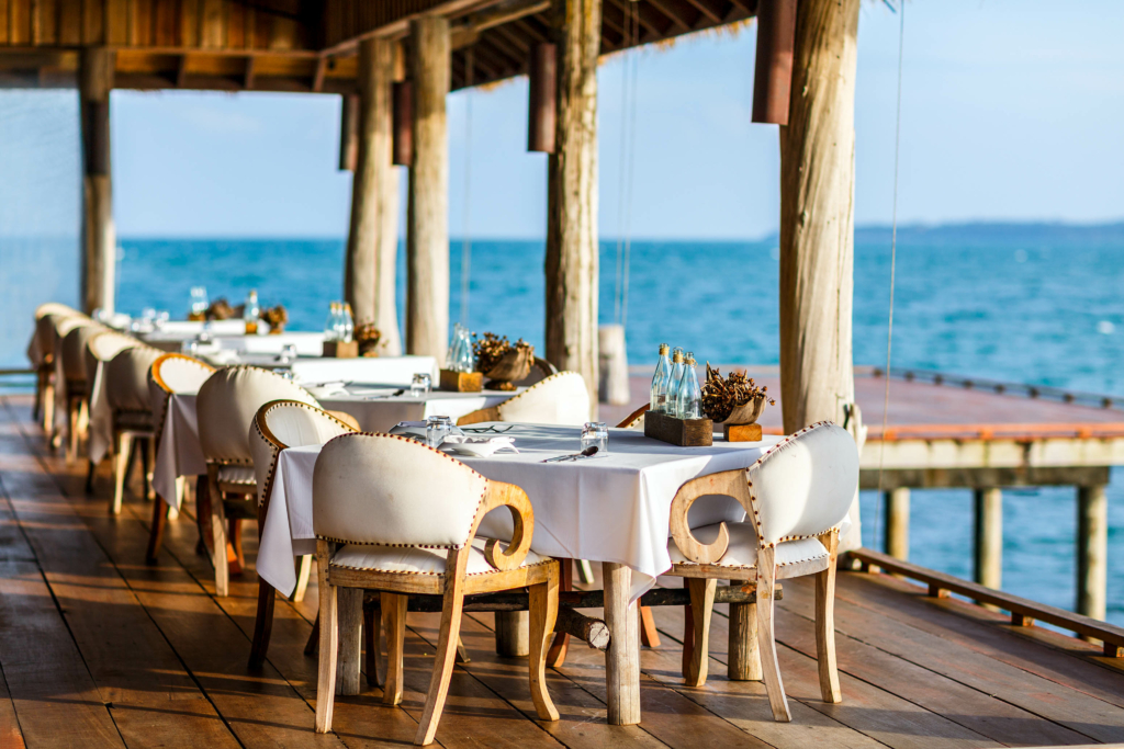 a restaurant with a view of the ocean.